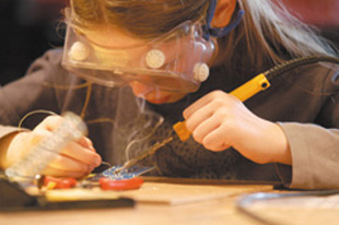 girl soldering